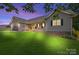 Inviting single-story home with a manicured lawn, covered porch, and attached garage at 105 Saddlewood Ln, Statesville, NC 28625