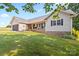 Beautiful single-story home featuring a covered porch and lush green lawn at 105 Saddlewood Ln, Statesville, NC 28625
