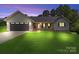 Charming single-story home with a well-manicured lawn and attached garage at 105 Saddlewood Ln, Statesville, NC 28625