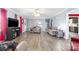 Open living room featuring hardwood floors, a ceiling fan, and neutral decor at 105 Saddlewood Ln, Statesville, NC 28625