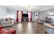 Cozy living room with neutral paint, wood floors, and modern lighting at 105 Saddlewood Ln, Statesville, NC 28625