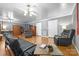 Cozy living room with hardwood floors, ceiling fans and comfortable furnishings at 105 Saddlewood Ln, Statesville, NC 28625