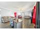 Spacious living room with hardwood floors, neutral walls, and ample seating at 105 Saddlewood Ln, Statesville, NC 28625