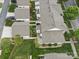 Aerial view of townhomes with well-manicured lawns, mature trees, and neatly arranged landscaping at 1061 Woodglen Ln, Matthews, NC 28104