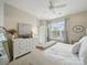 Bright bedroom with a white dresser and a large window for natural light at 1061 Woodglen Ln, Matthews, NC 28104