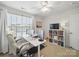 Bedroom featuring white desk and chair with computer, and a bookshelf at 1061 Woodglen Ln, Matthews, NC 28104