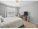 Bright bedroom with a large window, neutral walls, and decorative furnishings at 1061 Woodglen Ln, Matthews, NC 28104