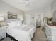 Bedroom showing bathroom, dresser and plush bed at 1061 Woodglen Ln, Matthews, NC 28104