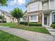 Attractive townhome with stone details, well-kept landscaping, and a inviting entrance at 1061 Woodglen Ln, Matthews, NC 28104
