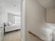 Hallway leading to a bedroom, showcasing neutral tones and natural light at 1061 Woodglen Ln, Matthews, NC 28104