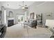 Bright living room with high ceilings, a fireplace, and access to the outdoors at 1061 Woodglen Ln, Matthews, NC 28104