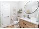 Well-lit bathroom with modern vanity, decorative mirror, and stylish fixtures at 1115 Maremont Ct, Matthews, NC 28104