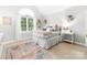 Bedroom featuring a large arched window and a pastel area rug at 1115 Maremont Ct, Matthews, NC 28104
