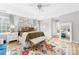 Bright main bedroom with tray ceilings, large bed, and decorative rug at 1115 Maremont Ct, Matthews, NC 28104