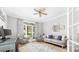 Comfortable office space with neutral tones, a ceiling fan, and natural light at 1115 Maremont Ct, Matthews, NC 28104