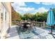 Spacious deck features an outdoor dining set, ample seating, and lush greenery in the background at 1115 Maremont Ct, Matthews, NC 28104