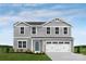 Charming two-story home featuring gray siding, white trim, a blue front door and an attached two-car garage at 12105 Beaux Art Ln, Charlotte, NC 28214
