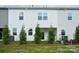 Backyard featuring a covered patio, privacy landscaping, and lawn area at 1213 Margo Mannor Dr, Fort Mill, SC 29708