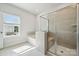 Bright bathroom with separate soaking tub and glass enclosed shower at 1213 Margo Mannor Dr, Fort Mill, SC 29708
