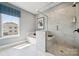 Bathroom with a glass enclosed shower and tub with natural light and modern accents at 1213 Margo Mannor Dr, Fort Mill, SC 29708