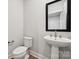 Half bath with sleek pedestal sink and modern fixtures at 1213 Margo Mannor Dr, Fort Mill, SC 29708