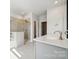 Bathroom featuring dual sinks, quartz countertop, and glass shower at 1213 Margo Mannor Dr, Fort Mill, SC 29708