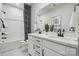 Elegant bathroom with double vanity, white countertops, black fixtures, and shower-tub combo at 1213 Margo Mannor Dr, Fort Mill, SC 29708