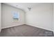 Cozy bedroom with plush gray carpet and a window providing natural light at 1213 Margo Mannor Dr, Fort Mill, SC 29708