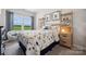 Bright bedroom features a dinosaur themed bed, decor and view to a vibrant green field at 1213 Margo Mannor Dr, Fort Mill, SC 29708