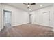 Large bedroom with neutral carpeting, a ceiling fan, and plenty of space at 1213 Margo Mannor Dr, Fort Mill, SC 29708