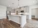 Bright kitchen with stainless steel appliances, a large island with pendant lighting, and stylish cabinetry at 1213 Margo Mannor Dr, Fort Mill, SC 29708