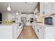 Modern kitchen featuring stainless steel appliances, white cabinets, and an island sink at 1213 Margo Mannor Dr, Fort Mill, SC 29708