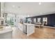 Open concept kitchen with a large island, stainless steel appliances, and modern lighting at 1213 Margo Mannor Dr, Fort Mill, SC 29708
