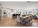 Open-concept kitchen and dining area with a breakfast bar and modern appliances leading to a cozy living space at 1213 Margo Mannor Dr, Fort Mill, SC 29708