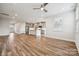 Open-concept living space with hardwood floors flowing into a modern kitchen at 1213 Margo Mannor Dr, Fort Mill, SC 29708