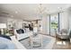 Bright living room showcasing open-concept design, stylish decor, and backyard view at 1213 Margo Mannor Dr, Fort Mill, SC 29708