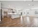 Spacious living room and kitchen combo with hardwood floors and a modern kitchen island at 1213 Margo Mannor Dr, Fort Mill, SC 29708