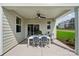 Covered patio with modern ceiling fan and stylish dining set, perfect for outdoor entertaining at 1213 Margo Mannor Dr, Fort Mill, SC 29708