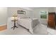 Charming bedroom with white wainscoting, decorative lamp, and window views at 1226 Tarrington Ave, Charlotte, NC 28205