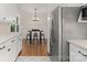 Charming kitchen leading to a dining nook with stainless steel appliances and ample cabinet space at 1226 Tarrington Ave, Charlotte, NC 28205