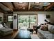 Cozy living room with beautiful backyard view, hardwood floors, and comfortable seating at 1226 Tarrington Ave, Charlotte, NC 28205