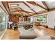 Spacious living room with beamed ceilings, hardwood floors, and comfortable seating area at 1226 Tarrington Ave, Charlotte, NC 28205