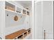 Hallway mudroom featuring built-in shelves, coat hooks, and convenient storage at 1226 Tarrington Ave, Charlotte, NC 28205