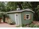 Charming outbuilding features a window with shutters, adding character to the property at 1226 Tarrington Ave, Charlotte, NC 28205