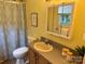 Clean bathroom featuring vanity with sink, toilet, shower with patterned curtain, and mirror at 1228 Hidden Creek Cir, Hickory, NC 28602