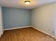 Bedroom features vinyl floors, neutral paint, and lots of natural light at 1228 Hidden Creek Cir, Hickory, NC 28602