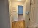 Hallway view featuring vinyl floors and neutral colored paint at 1228 Hidden Creek Cir, Hickory, NC 28602