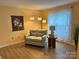 A well-lit living room showcases hardwood floors, neutral-toned walls, and a comfortable seating area at 1228 Hidden Creek Cir, Hickory, NC 28602