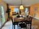 A comfortable living space features a dining table, hardwood floors, and open floor plan at 1228 Hidden Creek Cir, Hickory, NC 28602