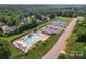 Aerial shot showcases community pool, tennis courts, and playground amenities at 1280 Winged Foot Dr, Denver, NC 28037